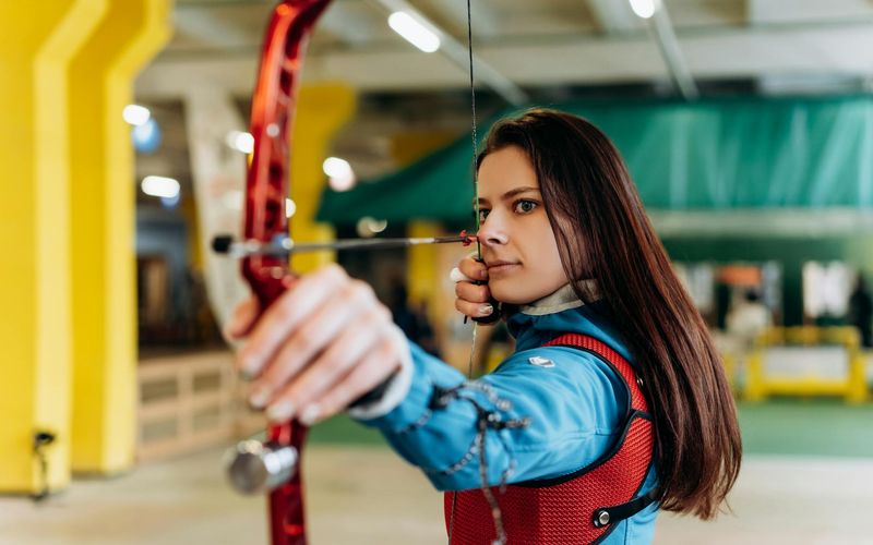 Wide shot of a person in the middle of a fluid motion exercise.